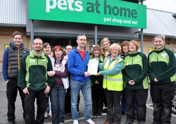 Store manager Mike Southwick is pictured presenting the cheque for £904.19p to Sheila Lawson of Yorkshire Coast Dog Rescue
